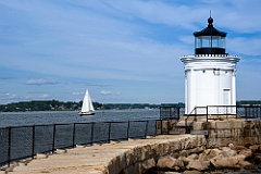 Sailboat in Harbor by Portland Breakwater Light